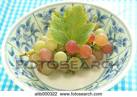 Stock Image - Grape on a plate. Fotosearch