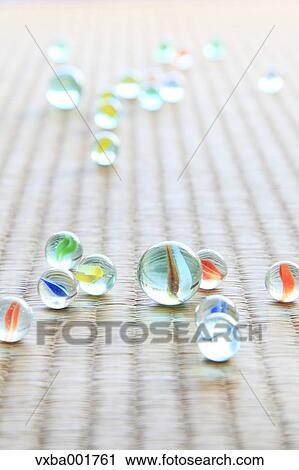 Stock Image - Marbles on tatami mat. Fotosearch
