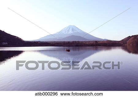 Stock Photograph - Mount Fuji reflected on water, Yamanashi Prefecture. Fotosearch