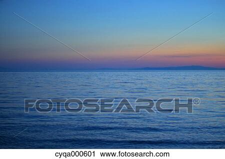 Sea and sky at sunset View Large Photo Image Stock Image - Sea and sky at sunset. Fotosearch