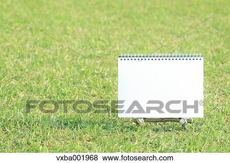 Sketchbook on lawn View Large Photo Image Stock Photo - Sketchbook on lawn. Fotosearch