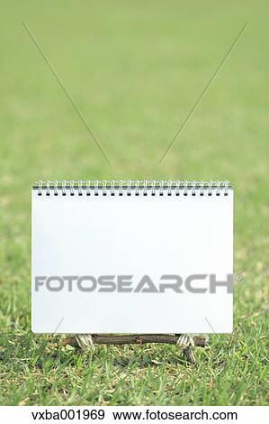 Sketchbook on lawn View Large Photo Image Stock Photo - Sketchbook on lawn. Fotosearch