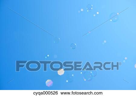 Soap bubbles in the blue sky View Large Photo Image Stock Photograph - Soap bubbles in the blue sky. Fotosearch