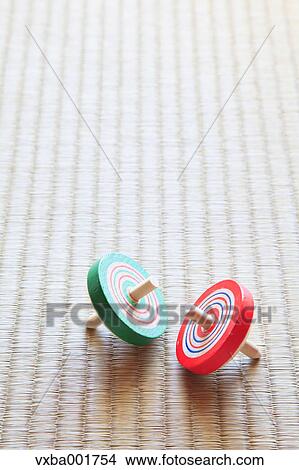 Spinning tops on tatami mat View Large Photo Image Picture - Spinning tops on tatami mat. Fotosearch