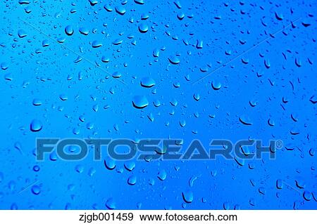 Raindrops on glass View Large Photo Image Stock Photo - Raindrops on glass. Fotosearch