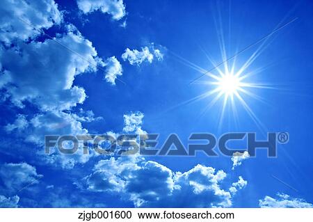 Stock Image - Sun and sky with clouds. Fotosearch