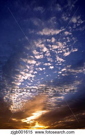 Sunset sky with clouds View Large Photo Image Stock Photography - Sunset sky with clouds. Fotosearch