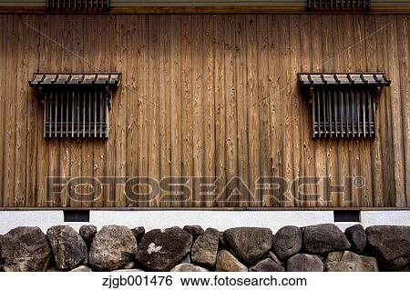 Wooden wall and small windows View Large Photo Image Stock Photograph - Wooden wall and small windows. Fotosearch