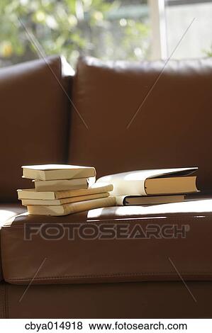 Books on a sofa View Large Photo Image Stock Photo - Books on a sofa. Fotosearch