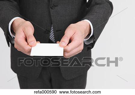 Businessman showing name card View Large Photo Image Stock Image - Businessman showing name card. Fotosearch