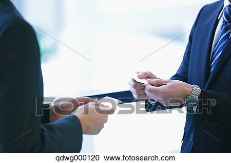 Businessmen exchanging name cards View Large Photo Image Stock Image - Businessmen exchanging name cards. Fotosearch