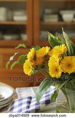 Flowers on a table View Large Photo Image Stock Photo - Flowers on a table. Fotosearch