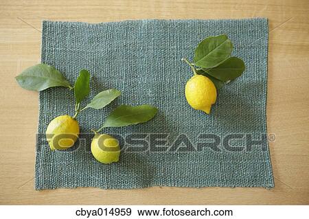 Lemons on a table View Large Photo Image Stock Photo - Lemons on a table. Fotosearch