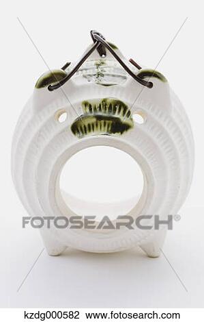 Stock Image - Pig shaped mosquito coil. Fotosearch