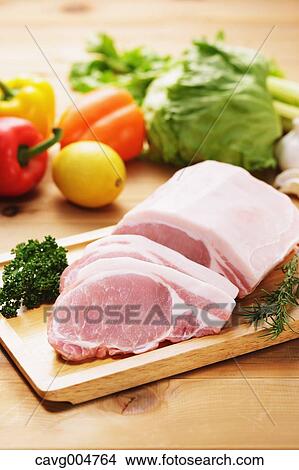 Raw pork meat and vegetables View Large Photo Image Picture - Raw pork meat and vegetables. Fotosearch
