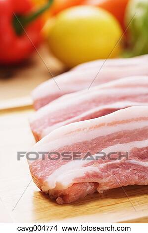 Raw pork meat and vegetables View Large Photo Image Picture - Raw pork meat and vegetables. Fotosearch