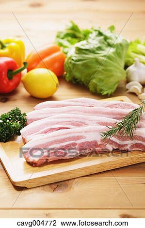 Raw pork meat and vegetables View Large Photo Image Stock Image - Raw pork meat and vegetables. Fotosearch