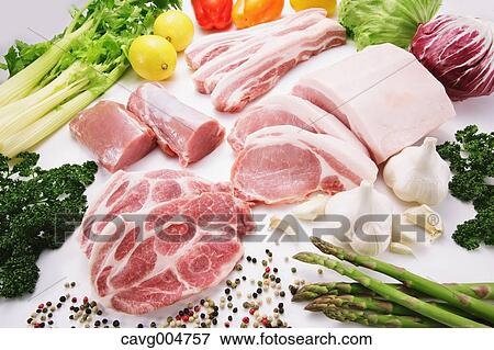Stock Photo - Raw pork meat and vegetables. Fotosearch