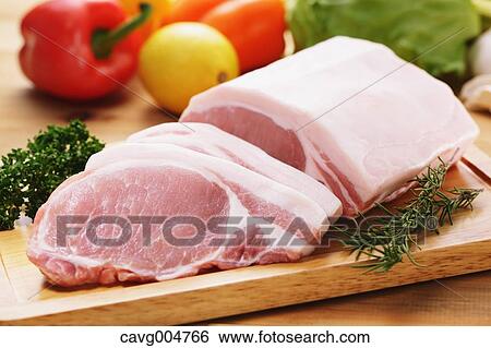 Raw pork meat and vegetables View Large Photo Image Stock Photograph - Raw pork meat and vegetables. Fotosearch