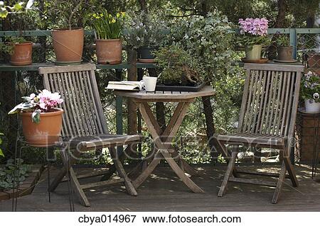 Stock Photo - Table and chairs in the garden. Fotosearch