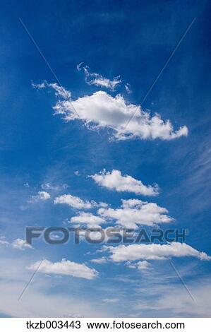 Blue sky with clouds View Large Photo Image Stock Image - Blue sky with clouds. Fotosearch