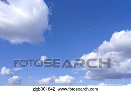 Blue sky with clouds View Large Photo Image Stock Image - Blue sky with clouds. Fotosearch