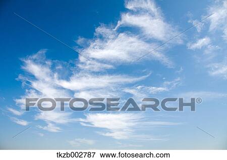 Blue sky with clouds View Large Photo Image Stock Photo - Blue sky with clouds. Fotosearch