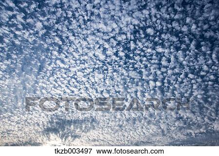Blue sky with clouds View Large Photo Image Stock Photo - Blue sky with clouds. Fotosearch