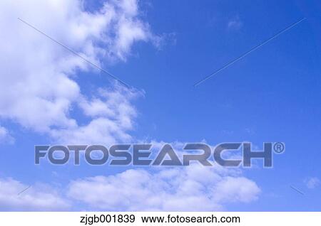 Blue sky with clouds View Large Photo Image Stock Photo - Blue sky with clouds. Fotosearch