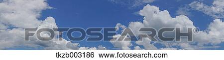 Blue sky with clouds View Large Photo Image Stock Photograph - Blue sky with clouds. Fotosearch