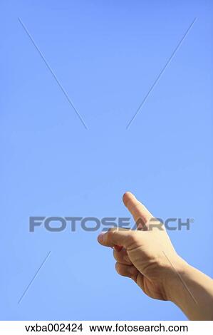 Picture - Child pointing a finger to the sky. Fotosearch