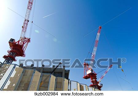 Construction site cranes View Large Photo Image Picture - Construction site cranes. Fotosearch