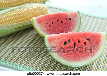 Picture - Corn and watermelon. Fotosearch