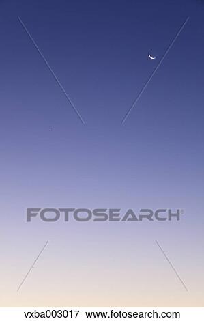 Crescent moon and dawn sky View Large Photo Image Stock Photo - Crescent moon and dawn sky. Fotosearch