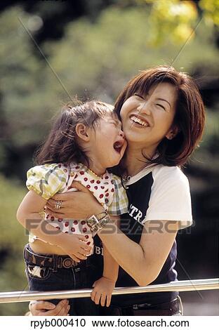 Japanese mother and daughter at the park View Large Photo Image Stock Image - Japanese mother and daughter at the park. Fotosearch