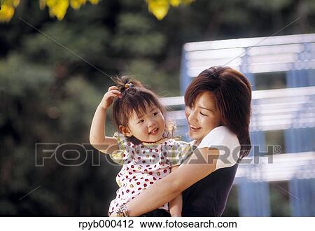Japanese mother and daughter at the park View Large Photo Image Stock Image - Japanese mother and daughter at the park. Fotosearch