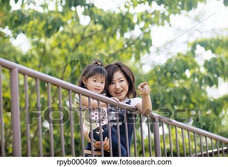 Japanese mother and daughter at the park View Large Photo Image Stock Photo - Japanese mother and daughter at the park. Fotosearch