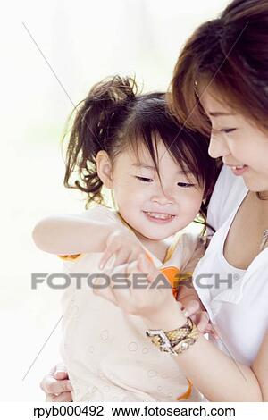 Japanese mother and daughter View Large Photo Image Stock Image - Japanese mother and daughter. Fotosearch