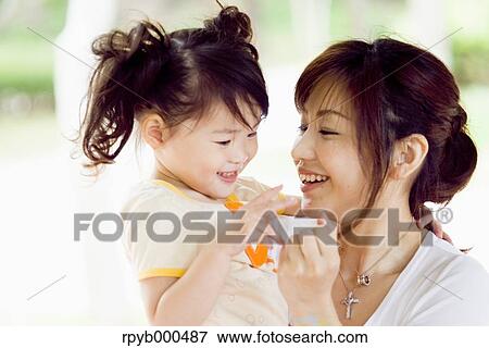 Japanese mother and daughter View Large Photo Image Stock Photo - Japanese mother and daughter. Fotosearch