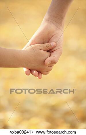 Stock Photo - Kids holding hands. Fotosearch
