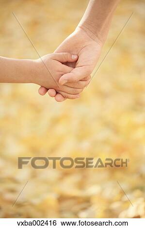 Stock Photograph - Kids holding hands. Fotosearch