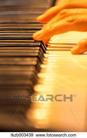 Playing piano View Large Photo Image Stock Photo - Playing piano. Fotosearch