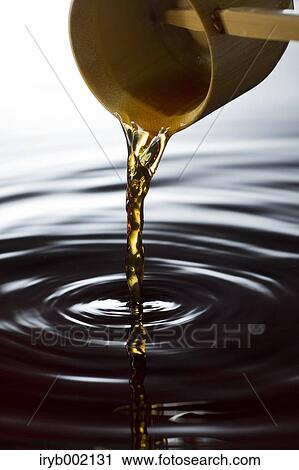Pouring black vinegar View Large Photo Image Stock Image - Pouring black vinegar. Fotosearch