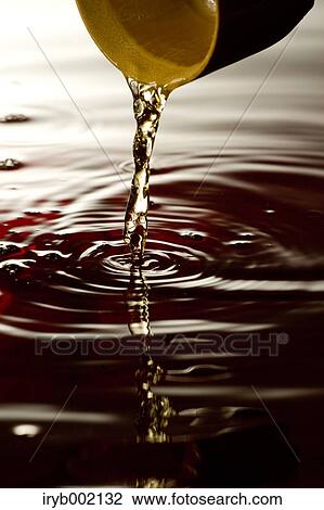 Pouring black vinegar View Large Photo Image Stock Image - Pouring black vinegar. Fotosearch