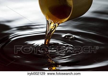 Pouring black vinegar View Large Photo Image Stock Photo - Pouring black vinegar. Fotosearch