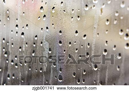 Stock Image - Raindrops on glass. Fotosearch