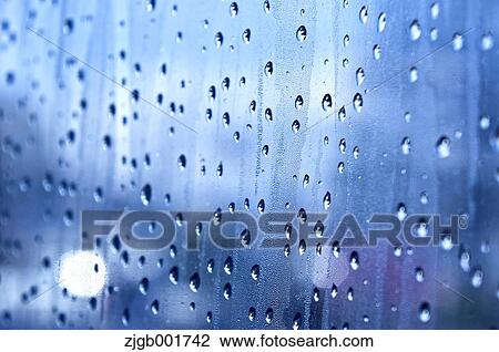 Stock Image - Raindrops on glass. Fotosearch