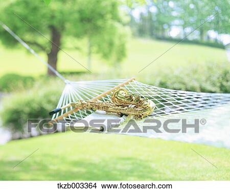Saxophone on hammock View Large Photo Image Picture - Saxophone on hammock. Fotosearch
