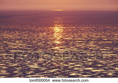 Sea at sunrise View Large Photo Image Picture - Sea at sunrise. Fotosearch