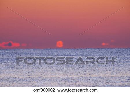 Sea at sunrise View Large Photo Image Stock Image - Sea at sunrise. Fotosearch